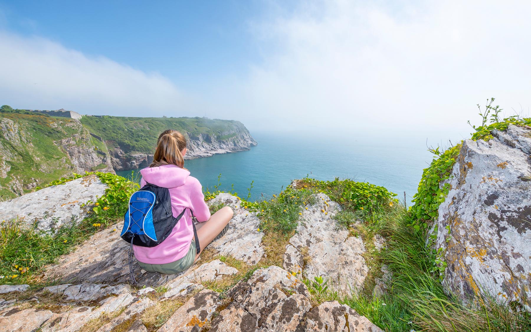 Berry Head teenager sitting on cliff top